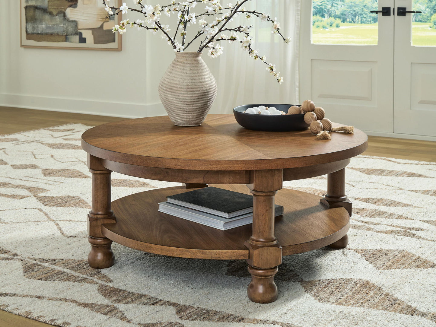 Chadworth - Round Cocktail Table - Medium Brown